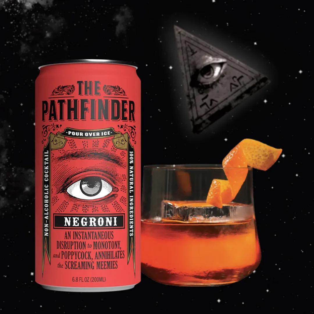 The Pathfinder Negroni 4-pack with non-alcoholic cocktail can and stirred glass garnished with orange peel.