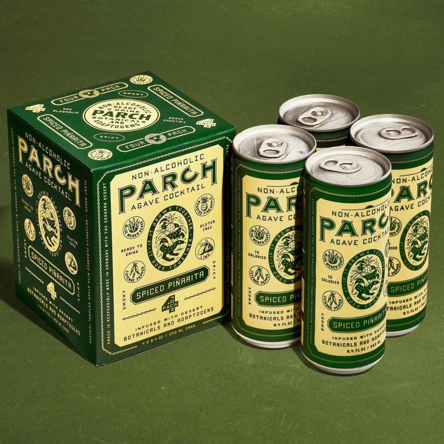 Parch Spiced Piñarita non-alcoholic agave cocktail 4-pack with pineapple, prickly pear, and desert botanicals on green background