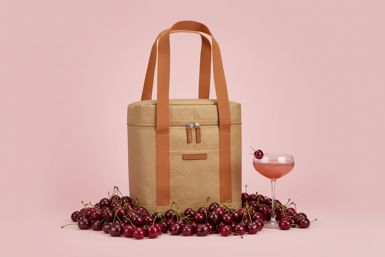 Beige tote bag with brown straps on a white background