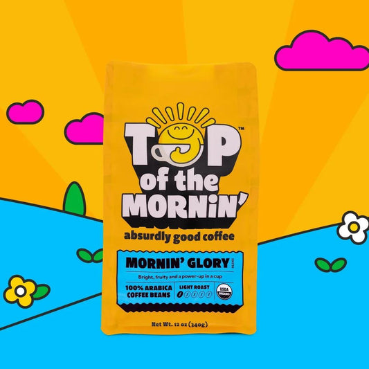 Bright yellow bag of Top of the Mornin' Morning Glory whole bean coffee with colorful playful background design.